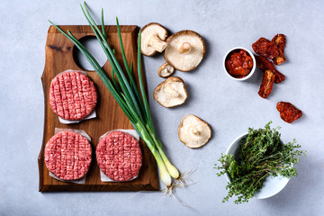 Raw fresh marbled minced meat Steak,seasonings on grey background