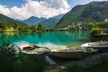 Fototapeta na wymiar Boats by the Soca river in Most na Soci, Slovenia