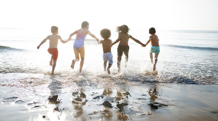 Group of kids enjoying their time at the beach