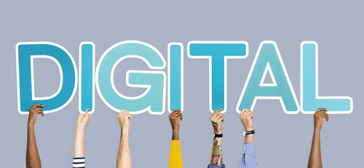 Hands holding up blue letters forming the word digital