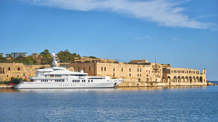 White yach docking near the fort Manoel in Malta