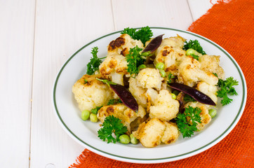 Vegetarian dish with cauliflower and peas