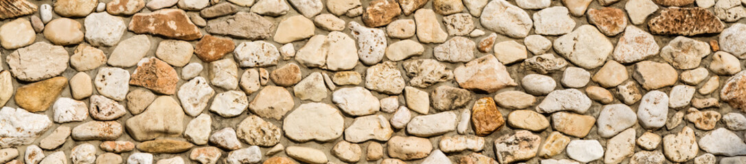 Stone wall texture background, panorama of masonry