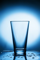 Empty Glass on a Blue Background