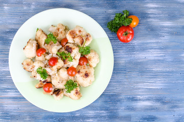 Dietary dish of cauliflower with tomatoes