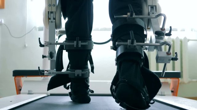 One patient uses medical device to learn how to walk by himself. 4K.