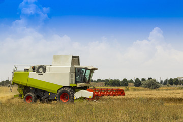 combine working in a field of wheat