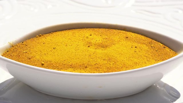 Dry spices curries on a rotary table. 4K. Macroshooting.