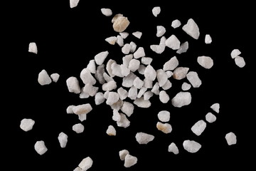 White rocks, gravel isolated on black background with clipping path, top view