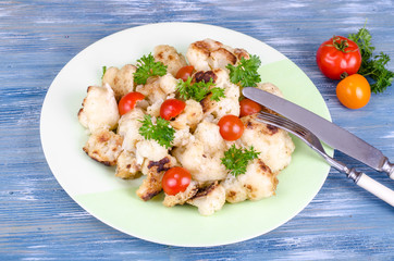 Dietary dish of cauliflower with tomatoes