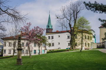 Fototapeta na wymiar Castle park in Frydek-Mistek town, Moravian-Silesian Region of Czech Republic, view with tower of John the Baptist Church