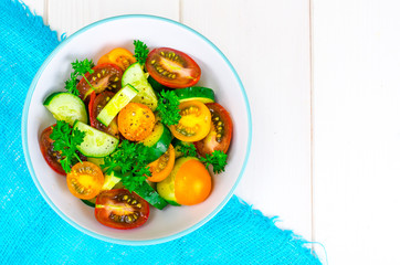 Dietary salad from tomatoes and cucumbers