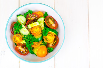 Dietary salad from tomatoes and cucumbers