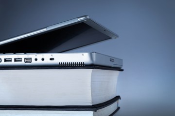 Laptop on Top of Books