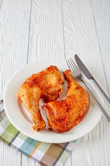 juicy fried chicken legs on a plate