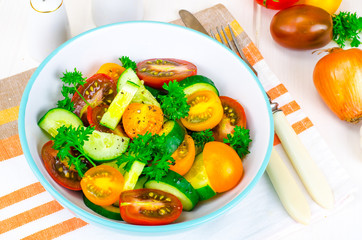 Dietary salad from tomatoes and cucumbers