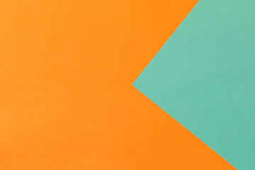Orange blue background texture of colored paper. Trendy colors for design. Abstract geometric background
