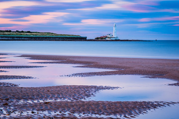Fototapeta na wymiar Long Exposure at Whitley Bay Beach / Whitley Bay Beach stretches from the Town north towards St Mary's Lighthouse