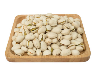 Pistachios on wooden plates.