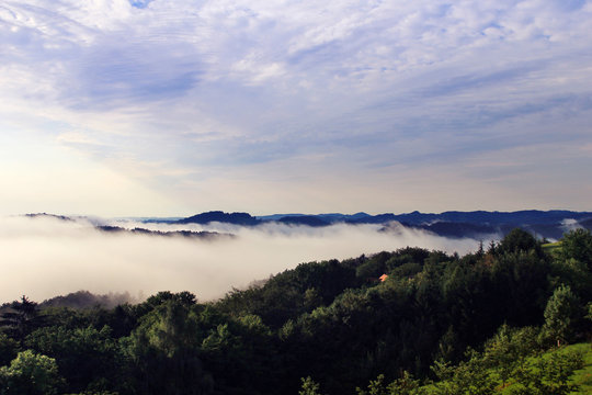 Fototapeta landscape with the sky, clouds and mountains