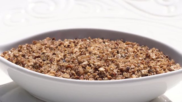 Dry spices mix of salt and pepper on a rotary table. 4K. Macroshooting.
