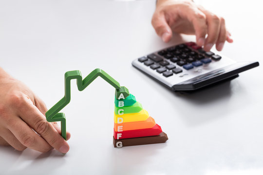 Close-up of a businessman using calculator