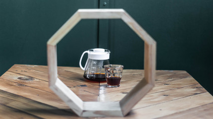 Fototapeta na wymiar Coffee on table framed by octagon
