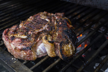 Grilled bbq meat steak on coal grill