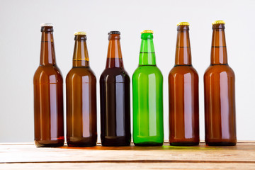 Beer bottles on a wooden table . Top view. Selective focus. Mock up. Copy space.Template. Blank.