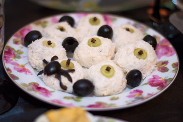 food for halloween with olive spider decoration