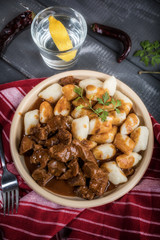 Beef stew with potatoes dumplings.