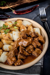 Beef stew with potatoes dumplings.