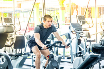 Fototapeta na wymiar Young sport man exercising in fitness gym
