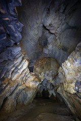 Inside the dark Tham Hoi Cave near Vang Vieng, Vientiane Province, Laos.