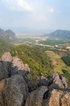 Scenic view of Vang Vieng and the surrounding area from above from the Phangern (Pha Ngern, Pha ngeun) mountain in Laos on a sunny day.