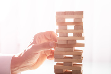 Businessman Stacking Wooden Blocks