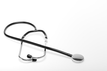 Studio shot of black stethoscope on white background, concept for healthcare object.