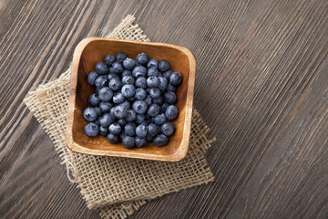 ripe sweet blueberries on wooden table