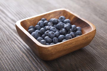 ripe sweet blueberries on wooden table