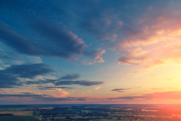 Obraz premium Cloudy sky at sunset. Evening in countryside