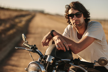 Fototapeta na wymiar Man on motorcycle at countryside
