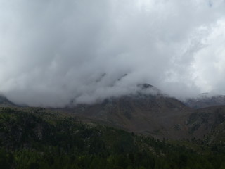 summit rock of the mountains in italy south tyrol europe in the clouds