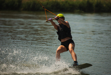 Young Woman Study Wakeboarding on a Lake