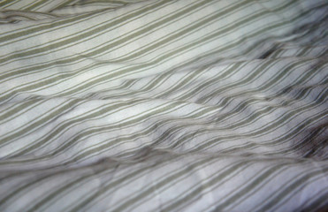 striped cloth gray blanket, white and gray stripes, cozy blanket