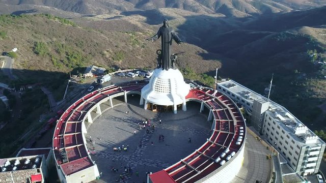 this location is Guanajuato Mexico; and its called "el cerro del cubilete" the statue is jesus which is located on the top of a mountain shot with a drone 4k