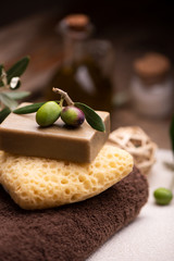 Natural spa with olive oil bar soap and towels