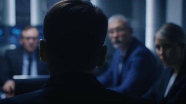 Chief Strategy Officer Making Report to a Board of Directors During Annual Financial Meeting in the conference Room. Business People / Politicians / Government Officials on a Meeting.