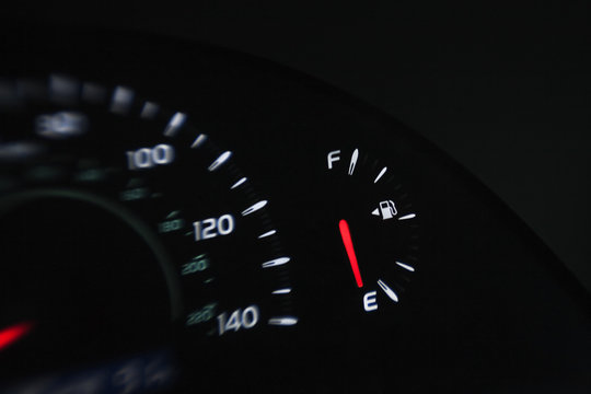 Close Up Of Gas Gauge On Empty In A Car.