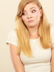 Fototapeta premium Sad cute young blonde attractive woman