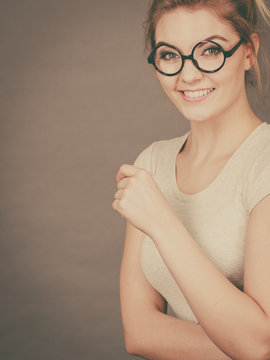 Happy teenage woman wearing eyeglasses